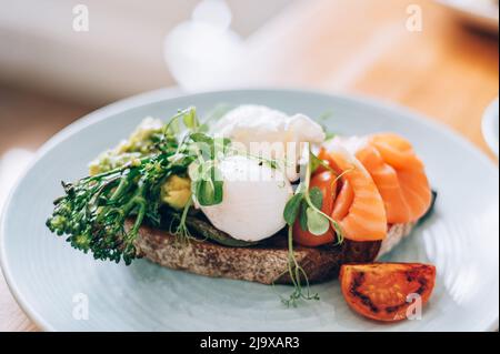 Healthy breakfast from poached eggs and veggies Stock Photo