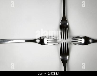 abstract background four forks in a cross Stock Photo