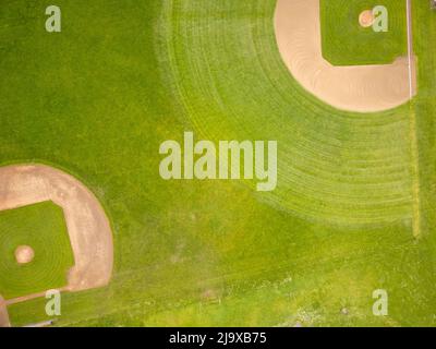 Top view of the green field for sports games. Sports, training, championships. Professional and amateur sports. Healthy lifestyle. There are no people Stock Photo