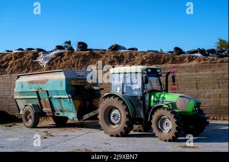 Feed greender for animals attached to tractor. Forage shredder Stock Photo