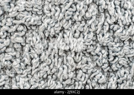 The texture of the gray color carpet close-up. Thick pile material Stock Photo