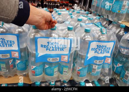 Buying Water in Recycled plastic bottles Stock Photo