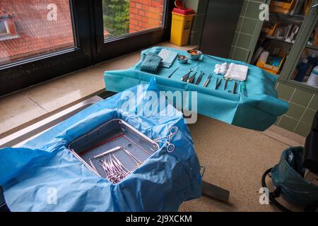 sterile instruments for performing small operation are placed on an instrument table Stock Photo