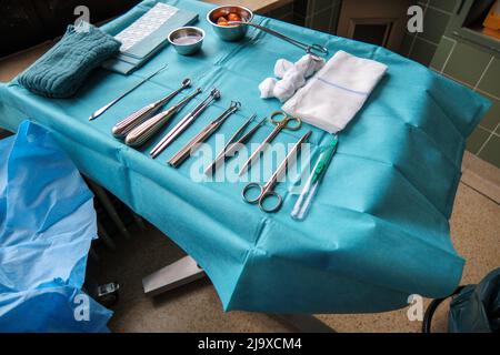 sterile instruments for performing small operation are placed on an instrument table Stock Photo