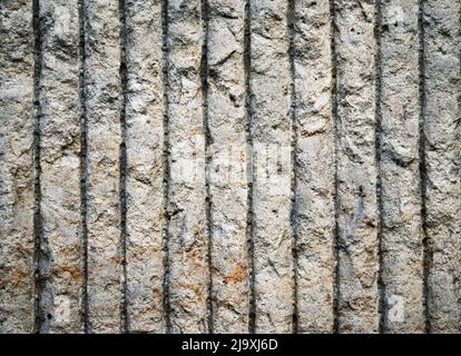 background or texture vertical grooved concrete wall Stock Photo