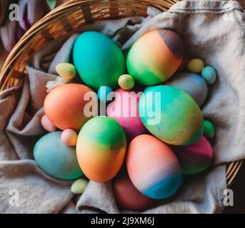 Close up top view of basket of colorful dyed easter eggs. Stock Photo