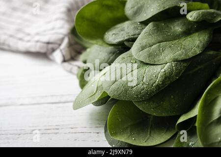 Freshly washed spinach on a linen towel Stock Photo