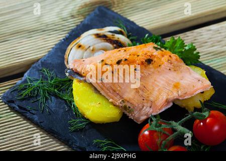 Slate with tender trout fillet, potatoes Stock Photo