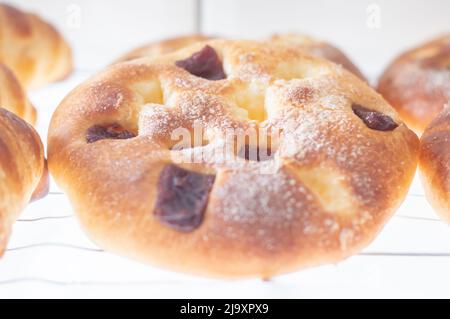 Greek tsoureki, Easter sweet bread, cozonac. Braided round brioche with guava, festive traditional dessert, top view. Stock Photo