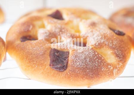 Greek tsoureki, Easter sweet bread, cozonac. Braided round brioche with guava, festive traditional dessert, top view. Stock Photo
