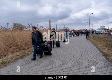 Medyka, Poland. 25th Feb, 2022. Refugees from Ukraine seen arriving at the polish border on the second day of Russian invasion of Ukraine. Ukraine - Polish border was crossed by millions of Ukrainian people. Polish people took most of them into their homes. Russia invaded Ukraine on 24 February 2022, triggering the largest military attack in Europe since World War II. (Credit Image: © Amadeusz Swierk/SOPA Images via ZUMA Press Wire) Stock Photo