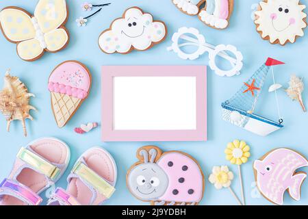 Bright creative layout made of white blank frame and cute summer symbols on pink background. Copy space, Top view, Flat lay. Mock up. Creative summer Stock Photo