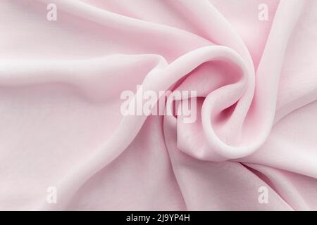 Wavy twisted pink fabric Stock Photo