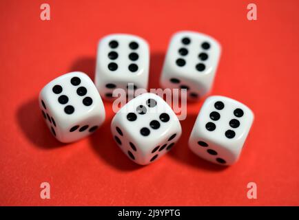 dice on red background close up Stock Photo