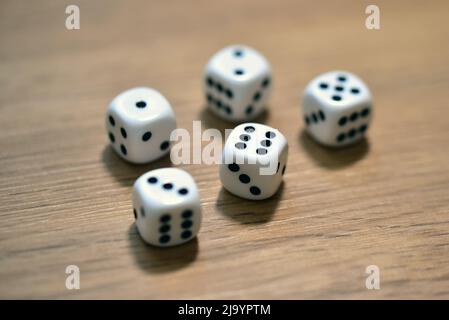 dice on a wooden table Stock Photo