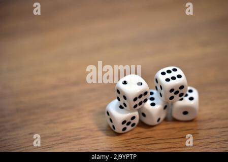 dice on a wooden table Stock Photo