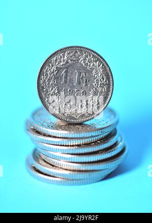 swiss two franc coin on blue background Stock Photo