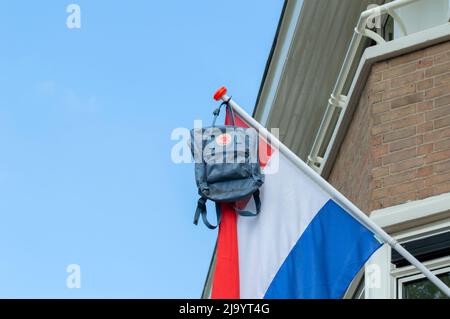 Close Up Schoolbag Hanging On A Flag At Amsterdam The Netherlands 13-6-2021 Stock Photo