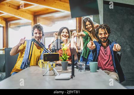 Millennial friends sharing vlog content on streaming platform with digital web camera - Modern lifestyle concept with smart people having fun vlogging Stock Photo