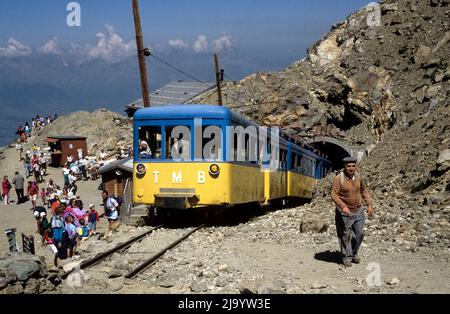 Yellow-blue carriages of the Tramway du Mont-Blanc mountain station and also terminus Gare du Nid d'Aigle, Saint-Gervais-les-Bains, France, 1990 Stock Photo