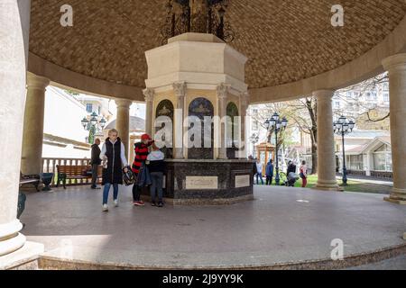 Kislovodsk, Russia - May 09, 2022: Pump room with various types of mineral water on Lenin Avenue. People pour mineral water. Inscriptions on taps in R Stock Photo