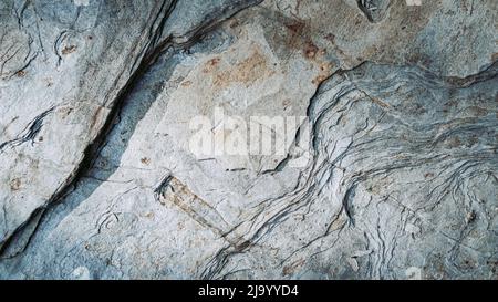 Rocky wall with uneven surface. Panaroramic Stock Photo