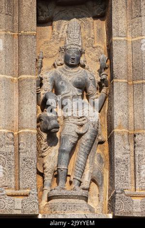 Carved idol of Lord Shiva as Ardhanarishwara half man and half woman on Gopuram of Nataraja Temple, Chidambaram, Tamil Nadu, India Stock Photo