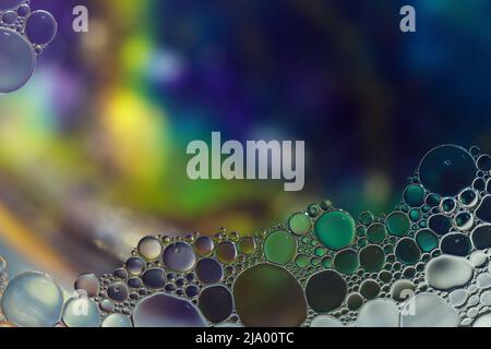 Fantasy colorful blurry background with ornament made of soft clear bubbles, abstract color splashes with copy space, focus on foreground Stock Photo