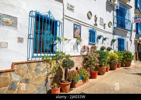 View to typical pedestrian street with picturesque facades in Torremolinos. Andalusia, Spain Stock Photo