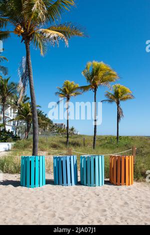 Colorful trash cans on the beach. Stock Photo