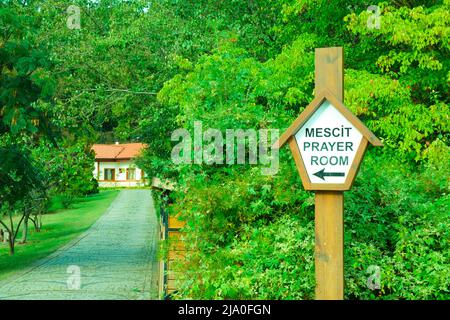 Prayer room sign direction for Muslim people walking in a city park Stock Photo