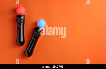 Virtual reality move controller on orange background Stock Photo