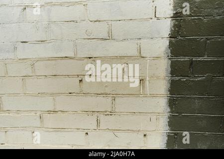 Aged brick wall painted white and grey..Background. Brick Wall Horizontal Texture. Brickwall Backdrop. Stonewall Wallpaper. Stock Photo