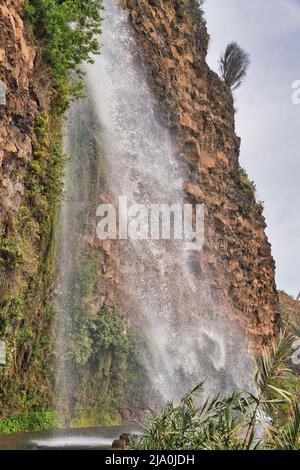 The Cascata dos Anjos, Angels Waterfall,Anjos, municipality of Ponta do Sol, on the Portuguese island of Madeira. The water cascades directly onto the Stock Photo