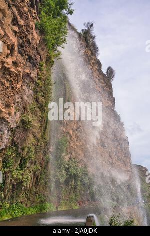 The Cascata dos Anjos, Angels Waterfall,Anjos, municipality of Ponta do Sol, on the Portuguese island of Madeira. The water cascades directly onto the Stock Photo