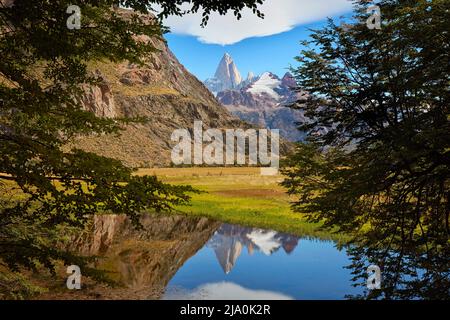 View over Mount Fitz Roy reflected in the waters of a lagoon, El Chalten, Santa Cruz, Patagonia, Argentina. Stock Photo