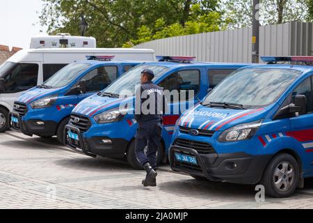 Istanbul, Turkey - May 09 2019: Officer of the Jandarma (Gendarmerie) walking next a row of gendarmerie vans. Stock Photo