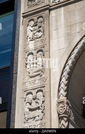 The Salmon Tower entrance at 11 West 42nd Street is limestone with 12 signs of the Zodiac, Midtown Manhattan, New York City, USA  2022 Stock Photo