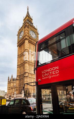 London, UK - Oct 28, 2012: Iconic  Red Double Decker bus Black Taxicab and Elizabeth Tower (Big Ben) at once Stock Photo