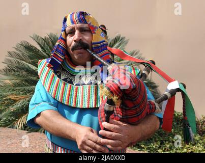 A Musician in Traditional Costume Playing Bagpipes in Cairo, Egypt. Stock Photo