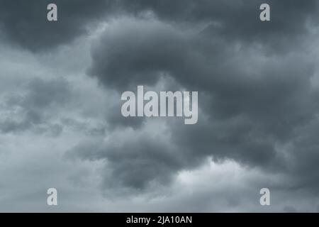 Abstract stormy weather clouds, dark gray ominous clouds, swirl movement in atmosphere Stock Photo