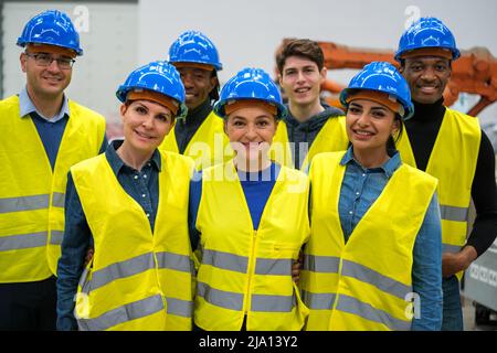 Group of engineers in factory working together Stock Photo