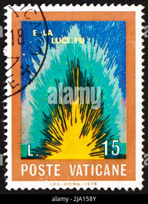 VATICAN - CIRCA 1974: a stamp printed in the Vatican shows Light, And There was Light, Quote from The Bible, circa 1974 Stock Photo