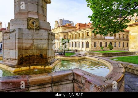 Ancient fountain in front of the Town Hall of the medieval city of Leon in Spain. Stock Photo