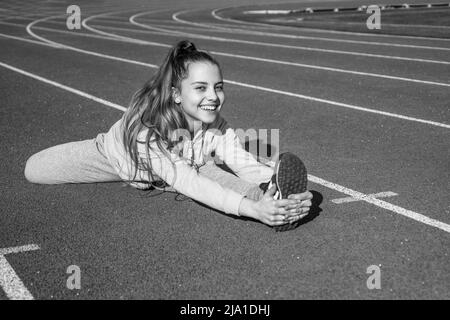 Teen girl warming up. sporty kid in sportswear outdoor. sport and