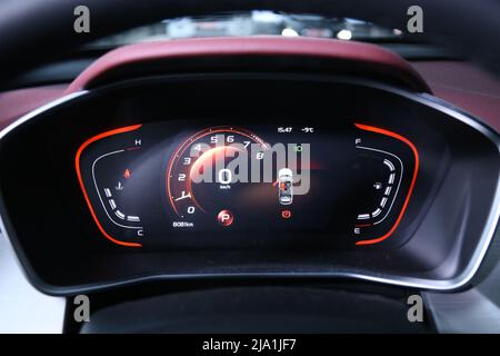 Digital instrument panel in a modern car. Meter of modern hybrid car, Air conditioning car, cockpit interior cabin details. Stock Photo