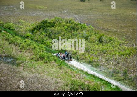 Stock images of Everglades National Park, Florida - Airboats flying over the Everglades National Park. Everglades Airboat Tours Glide and Guide Throug Stock Photo