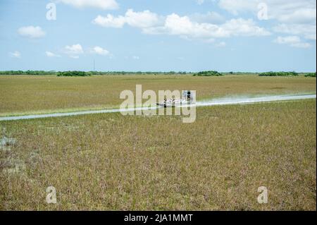 Stock images of Everglades National Park, Florida - Airboats flying over the Everglades National Park. Everglades Airboat Tours Glide and Guide Throug Stock Photo