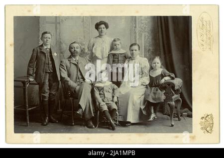 Edwardian cabinet card of attractive prosperous large middle or upper middle class Edwardian family, children of different ages, teenage years and young adult, boys and girls, studio of A & G Taylor, Sunderland. circa 1906 Stock Photo