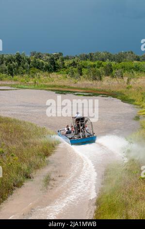 Stock images of Everglades National Park, Florida - Airboats flying over the Everglades National Park. Everglades Airboat Tours Glide and Guide Throug Stock Photo